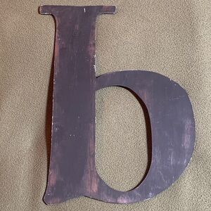 Black and brown distressed painted cardboard lower case b. Approx 16” x 11 3/4”